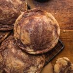 Marbled cookies scattered on a cookie sheet with sugar.