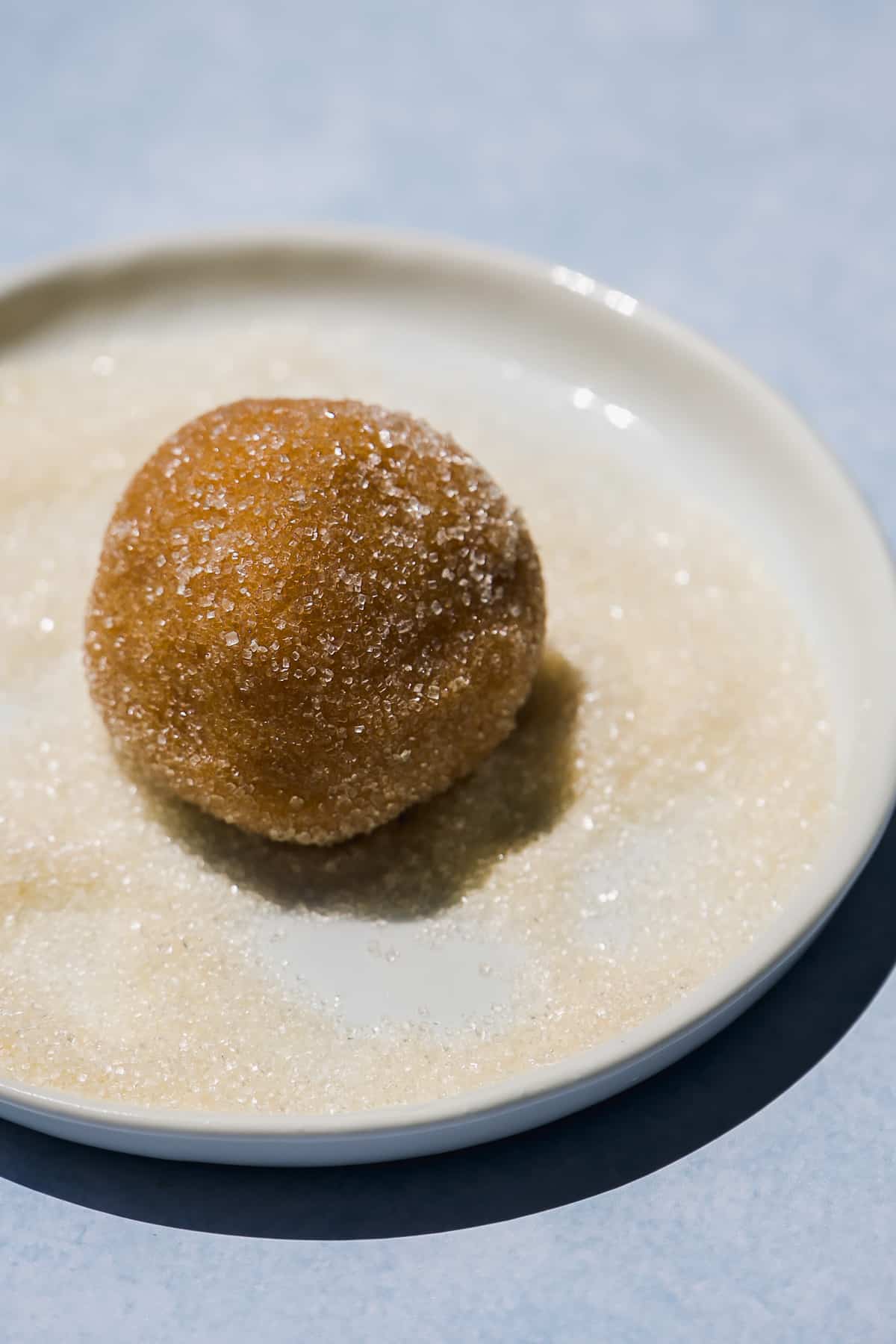 Almond flour peanut butter cookie dough ball rolled in sugar.