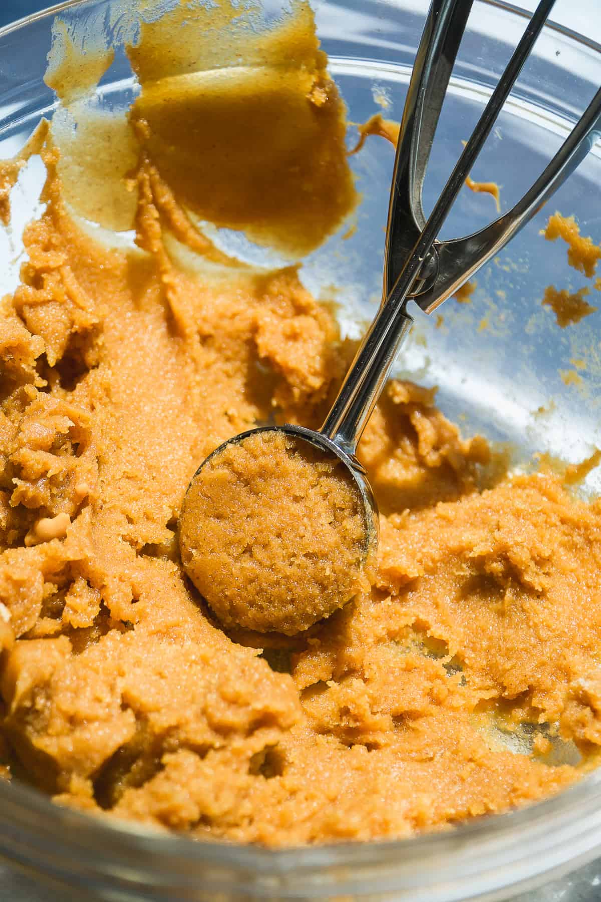 Almond flour peanut butter cookie dough in a glass bowl.