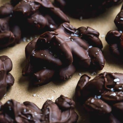 Chocolate almond clusters on a baking sheet.