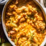 Chicken fajita casserole in an oval dish with plate on the side.