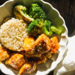 Bowl with rice, broccoli, and honey sesame chicken.