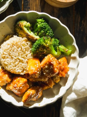 Bowl with rice, broccoli, and honey sesame chicken.