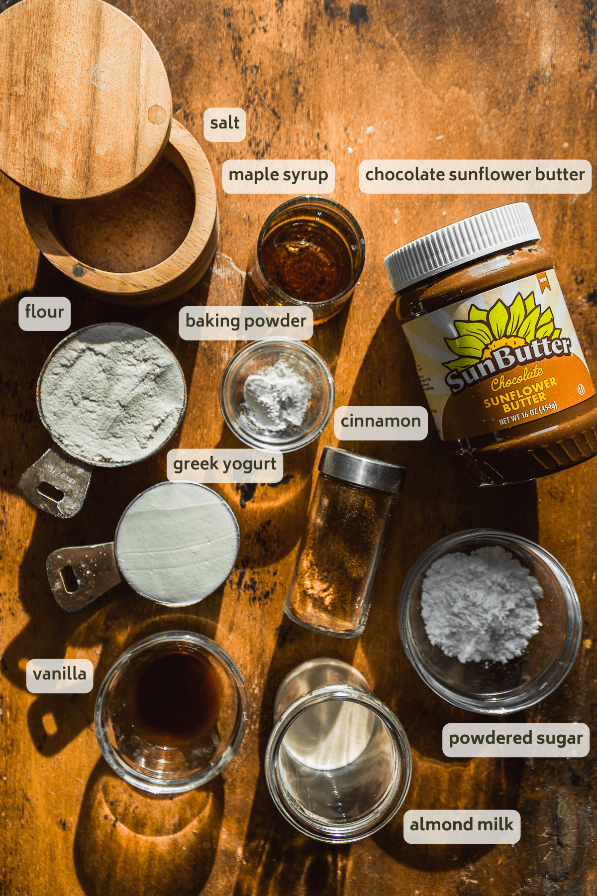 Single serve cinnamon roll ingredients on a wooden surface.