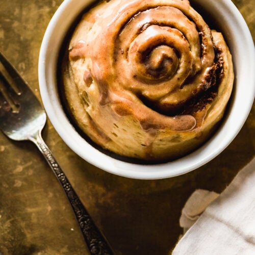 Overhead view of a single serve cinnamon roll with chocolate SunButter filling.