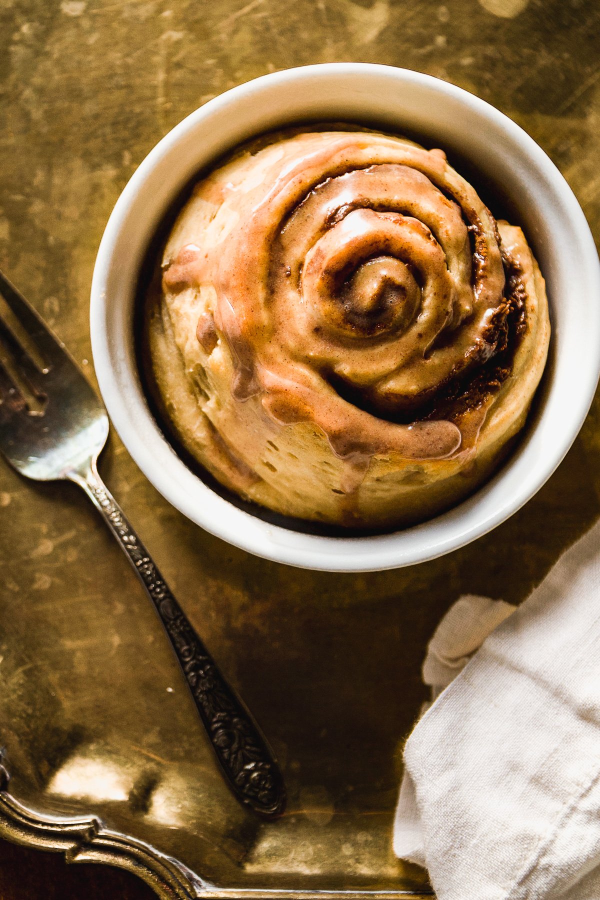 Overhead view of a single serve cinnamon roll with chocolate SunButter filling.