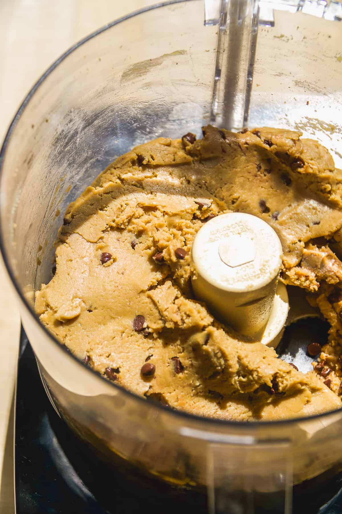 Chickpea cookie dough protein bars in a food processor.