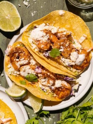 Overhead view of baja shrimp tacos on a plate.