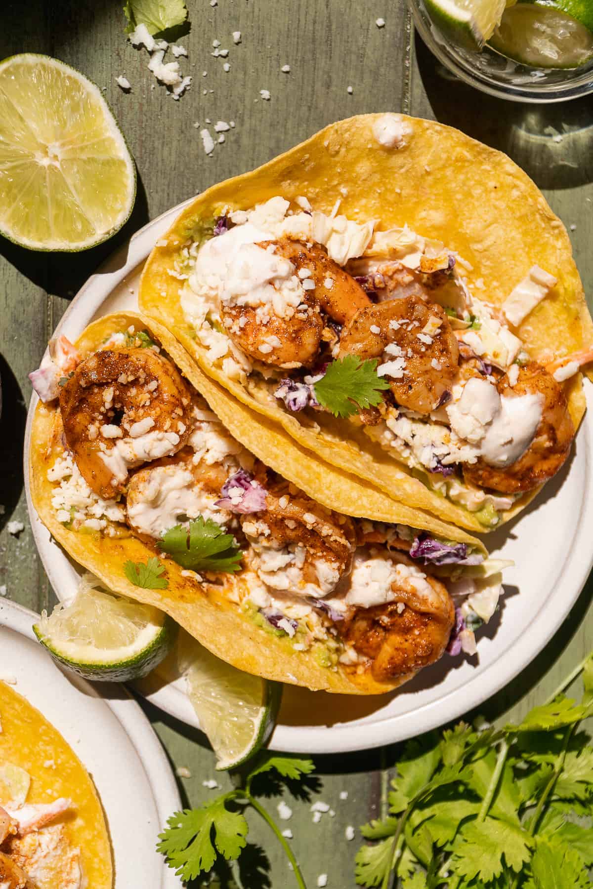 Overhead view of baja shrimp tacos on a plate.