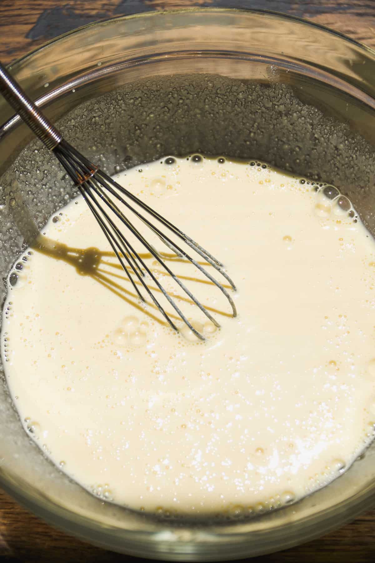Oat flour pancake batter in a glass bowl.