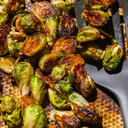 Caramelized brussel sprouts on a baking sheet.