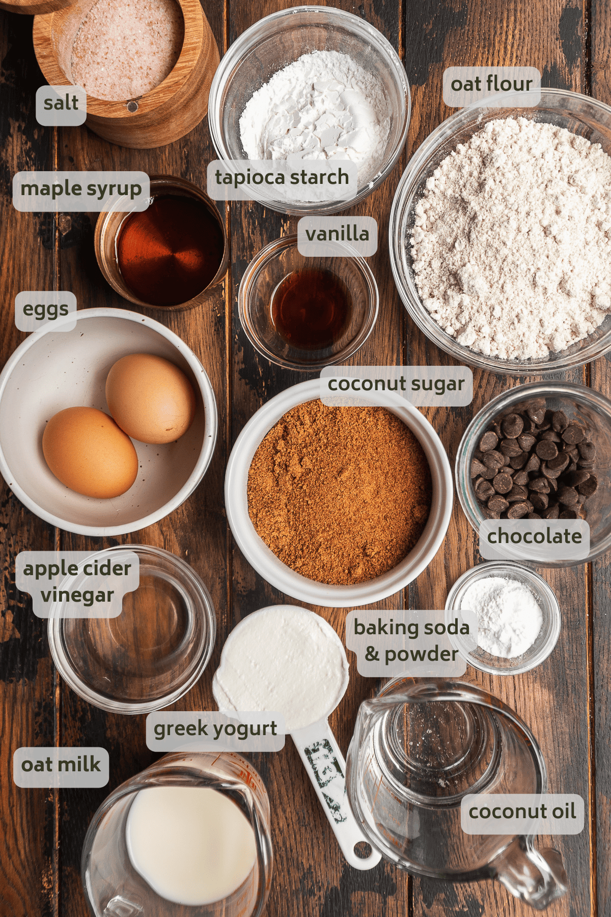 Oat flour cake ingredients on a wooden surface.