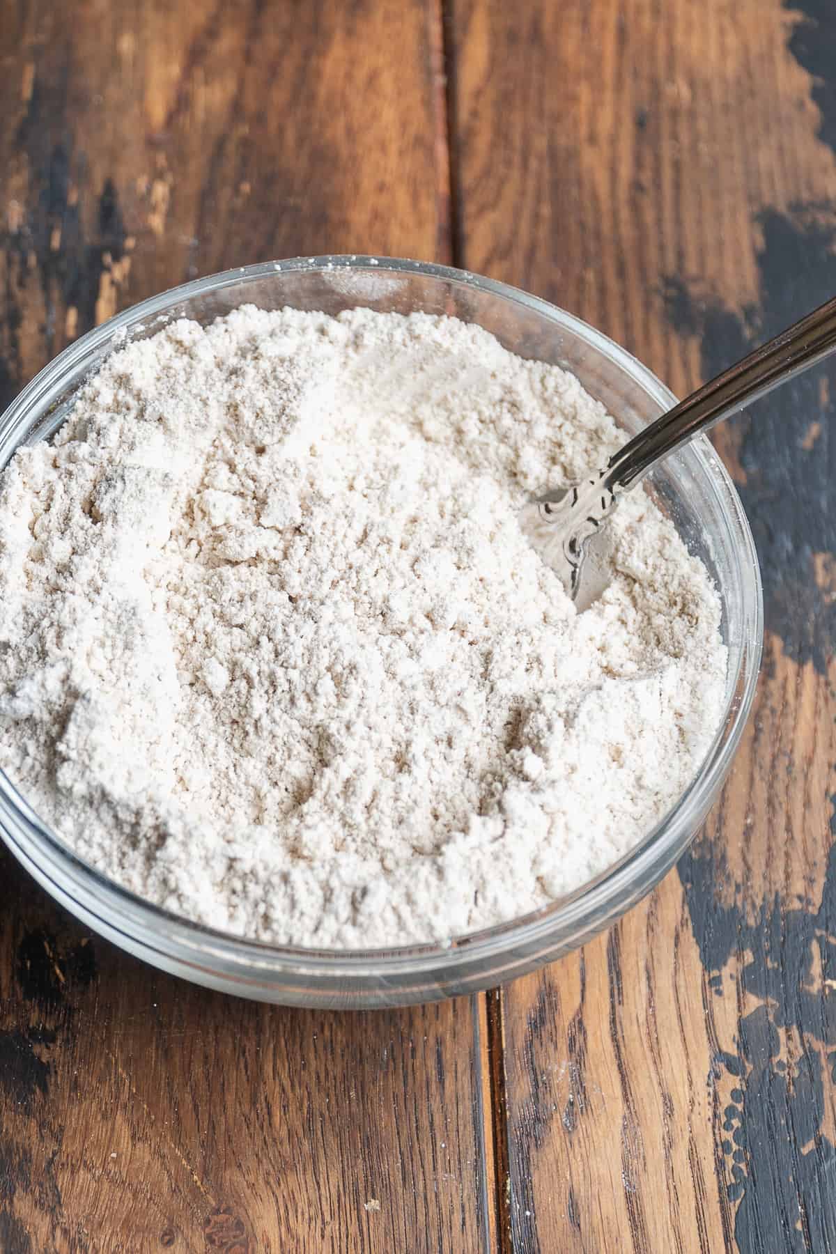 Oat flour cake dry ingredients mixed in a bowl.