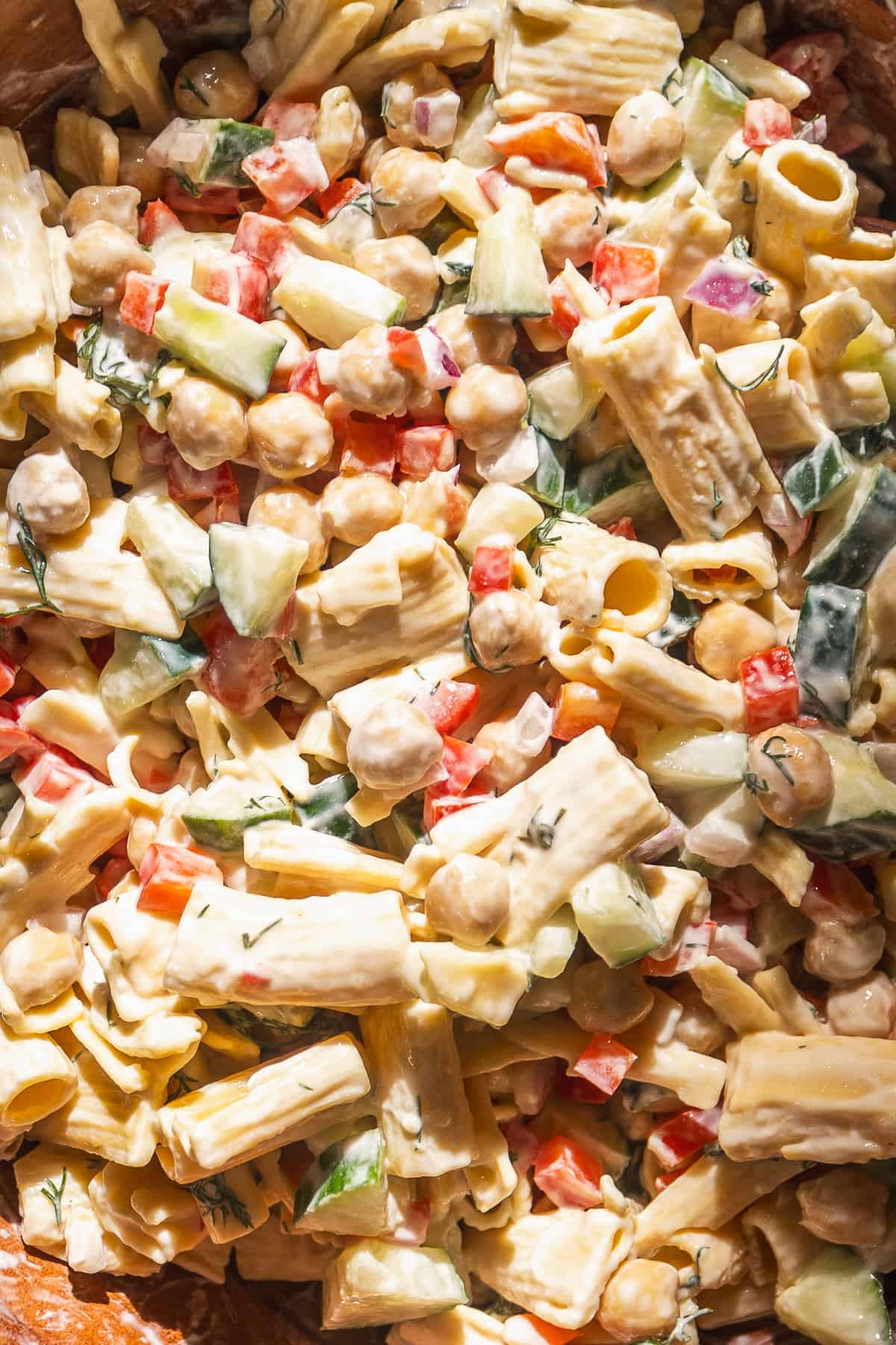 Overhead view of chickpea pasta salad with a greek yogurt dressing.