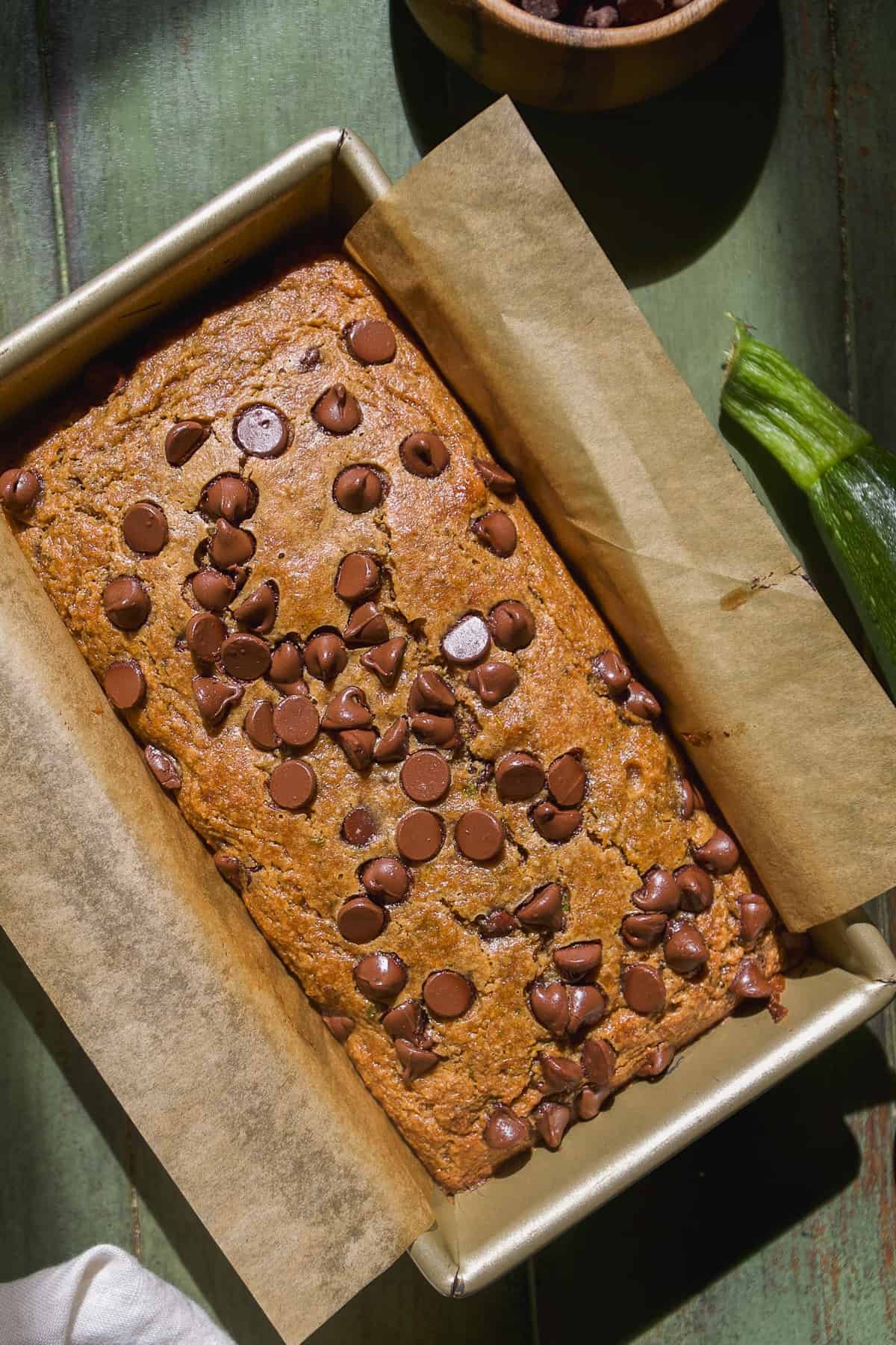 Overhead view of chocolate chip zucchini bread in a loaf pan.