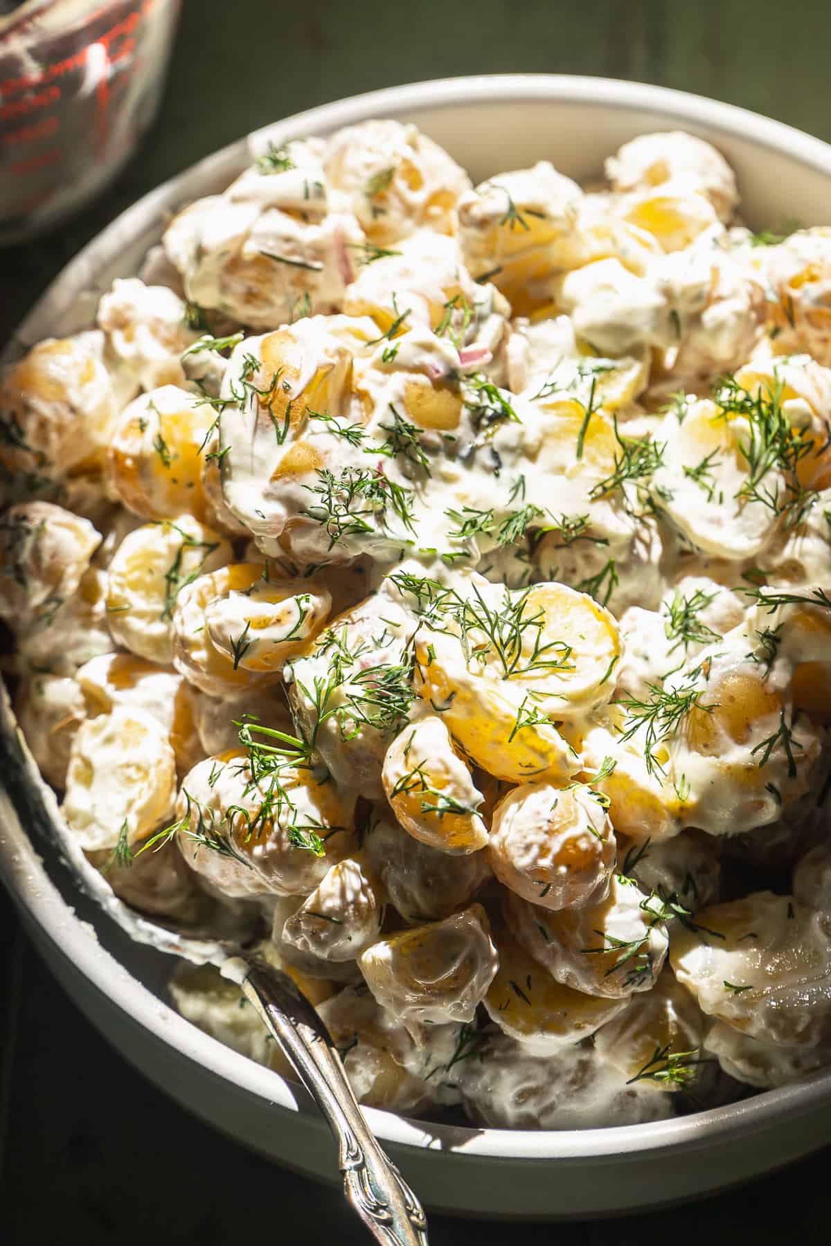 Dill yogurt mini potato salad in a circular dish.