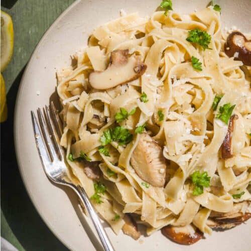 Truffle pasta in a bowl with herbs.