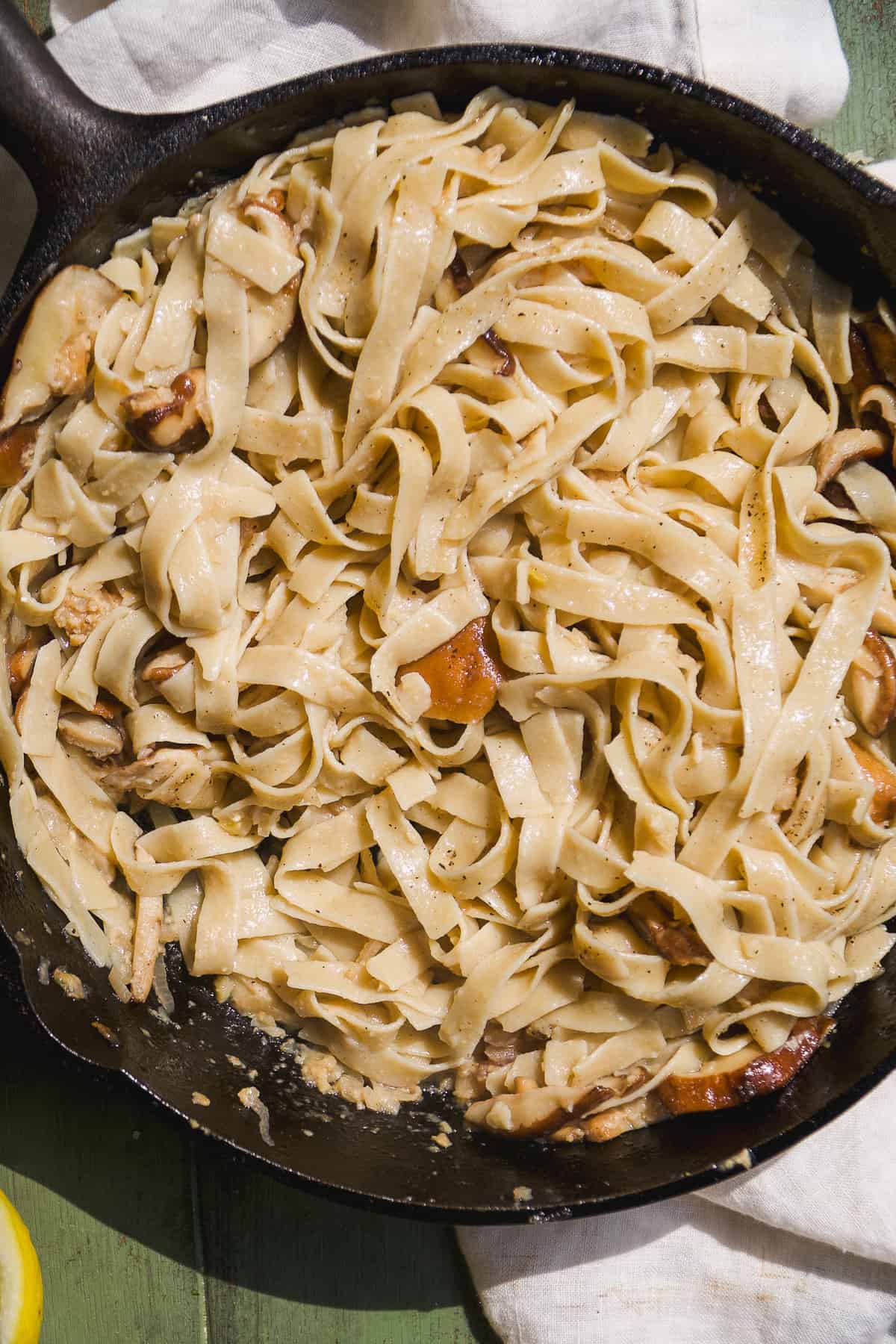 Truffle pasta cooking in a cast iron skillet.