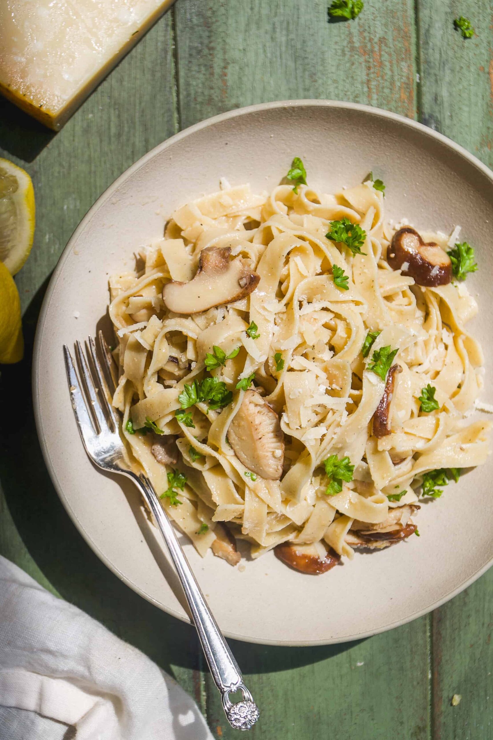 Bowl with truffle pasta and topped with herbs.