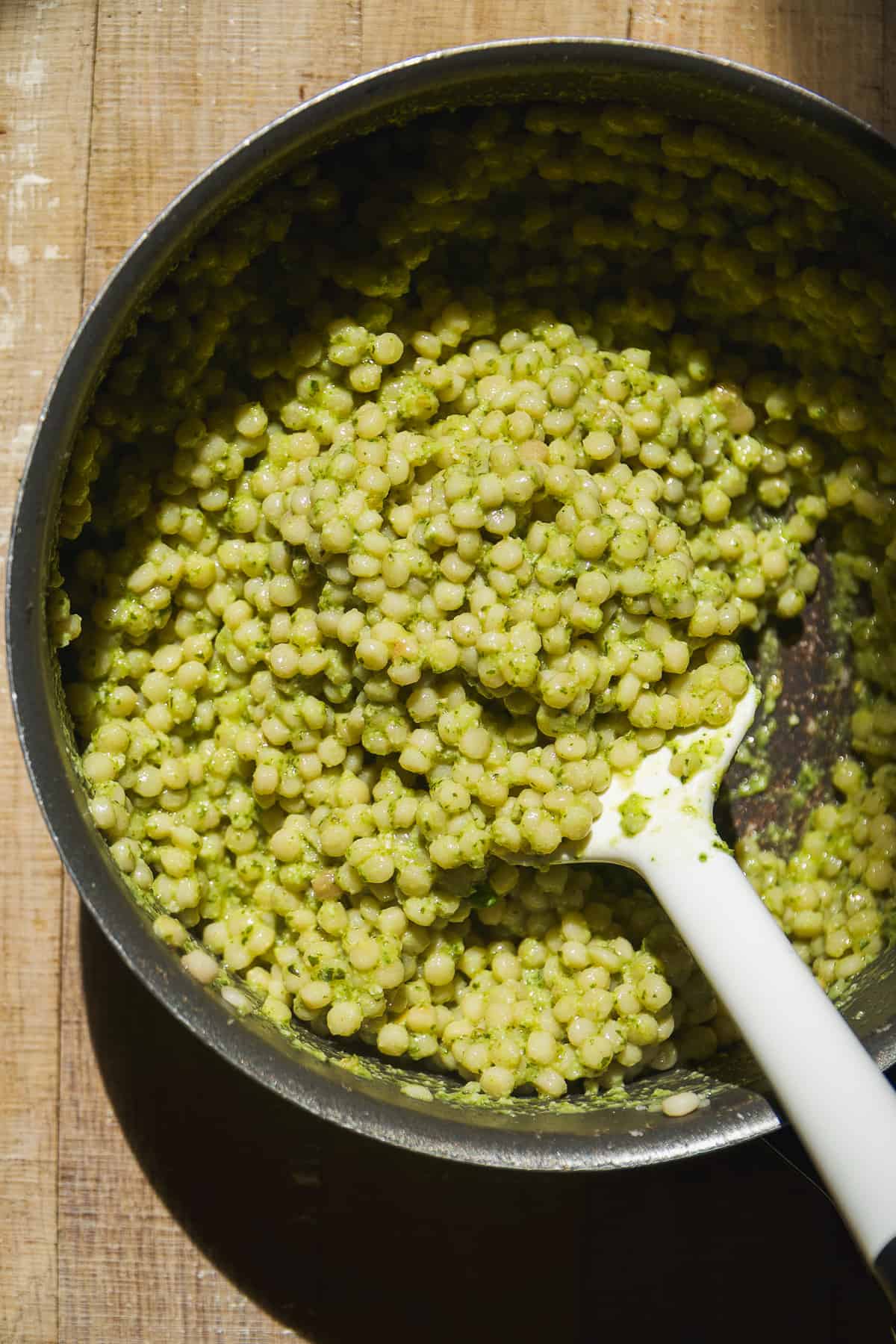 Dairy free pesto couscous in a pot.