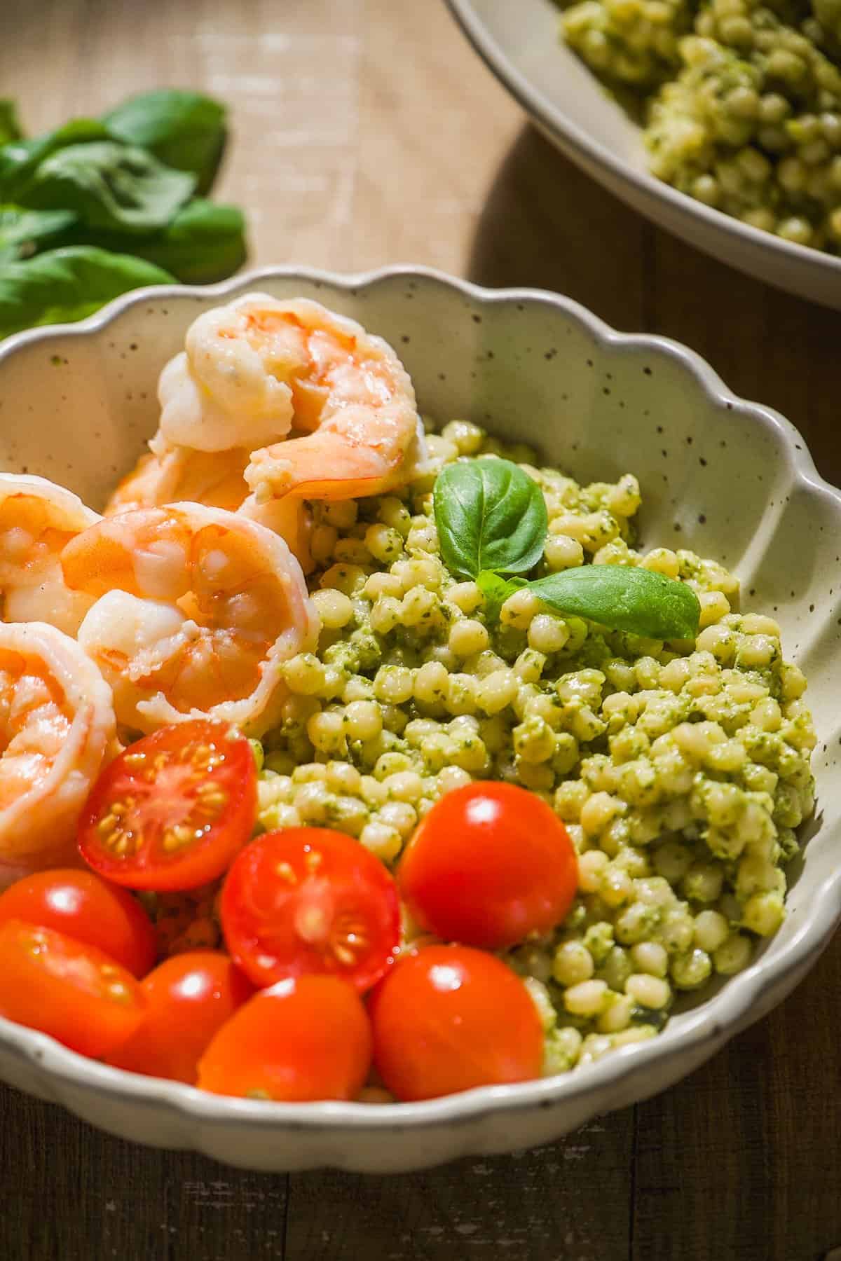 Pesto shrimp bowls with tomatoes.