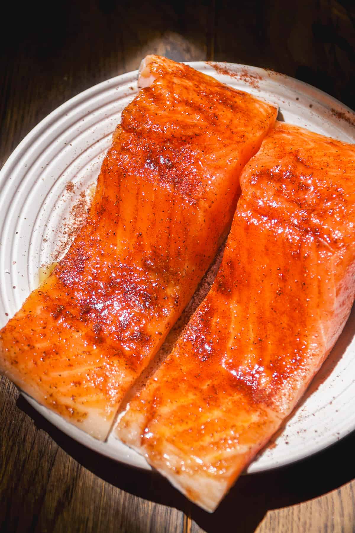 Seasoned salmon filets about to be cooked in air fryer.