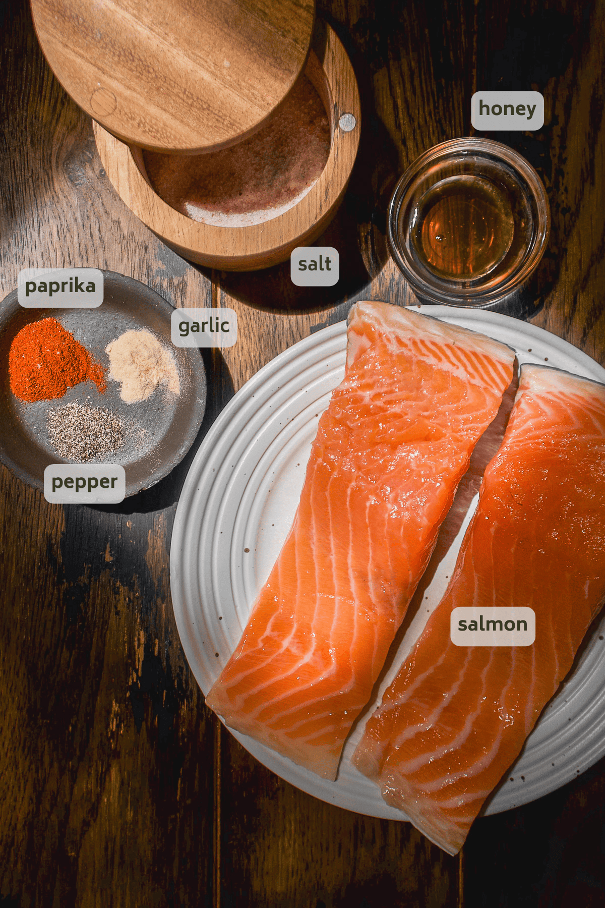Air fried honey garlic salmon ingredients on a wooden surface.