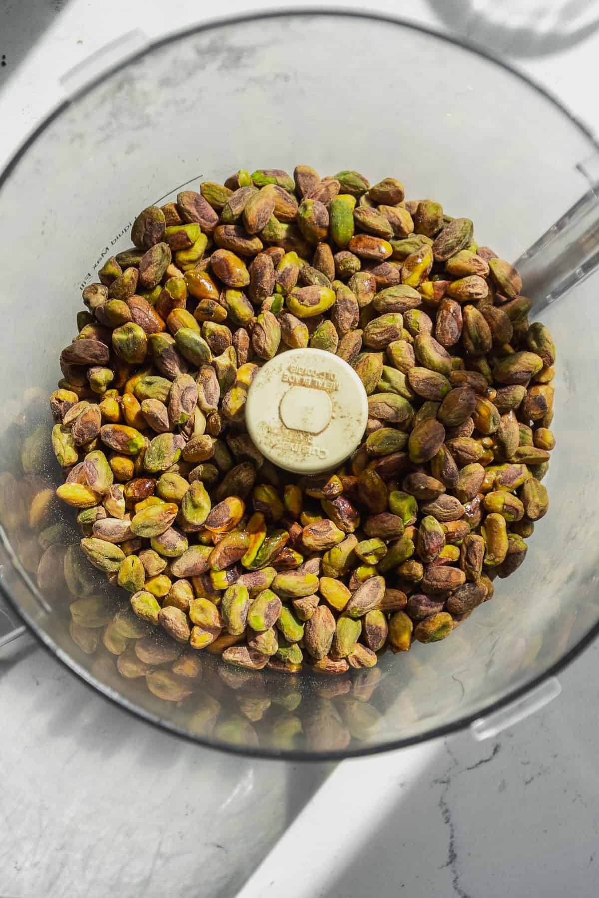 Overhead view of pistachios about to be blended into pistachio butter.