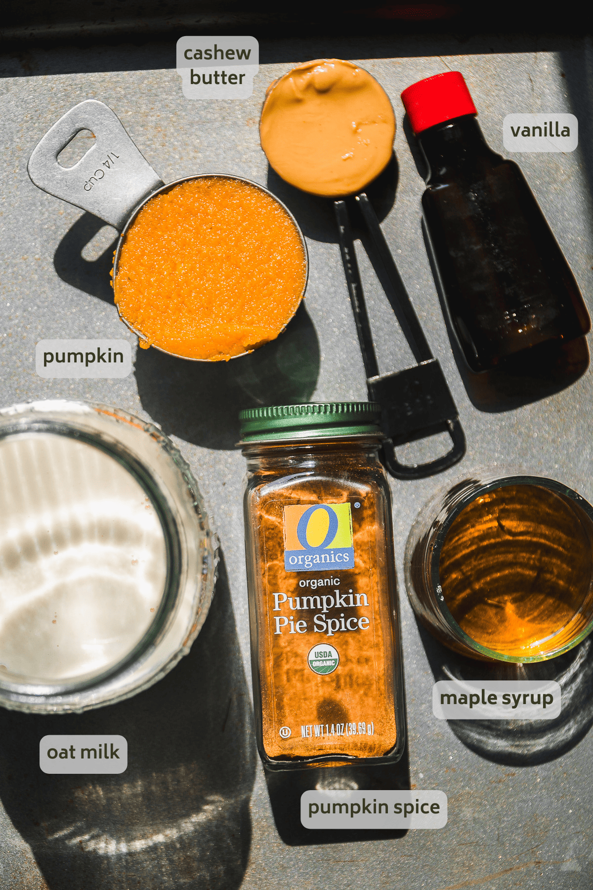 Pumpkin cream cold brew ingredients on a baking sheet with labels.