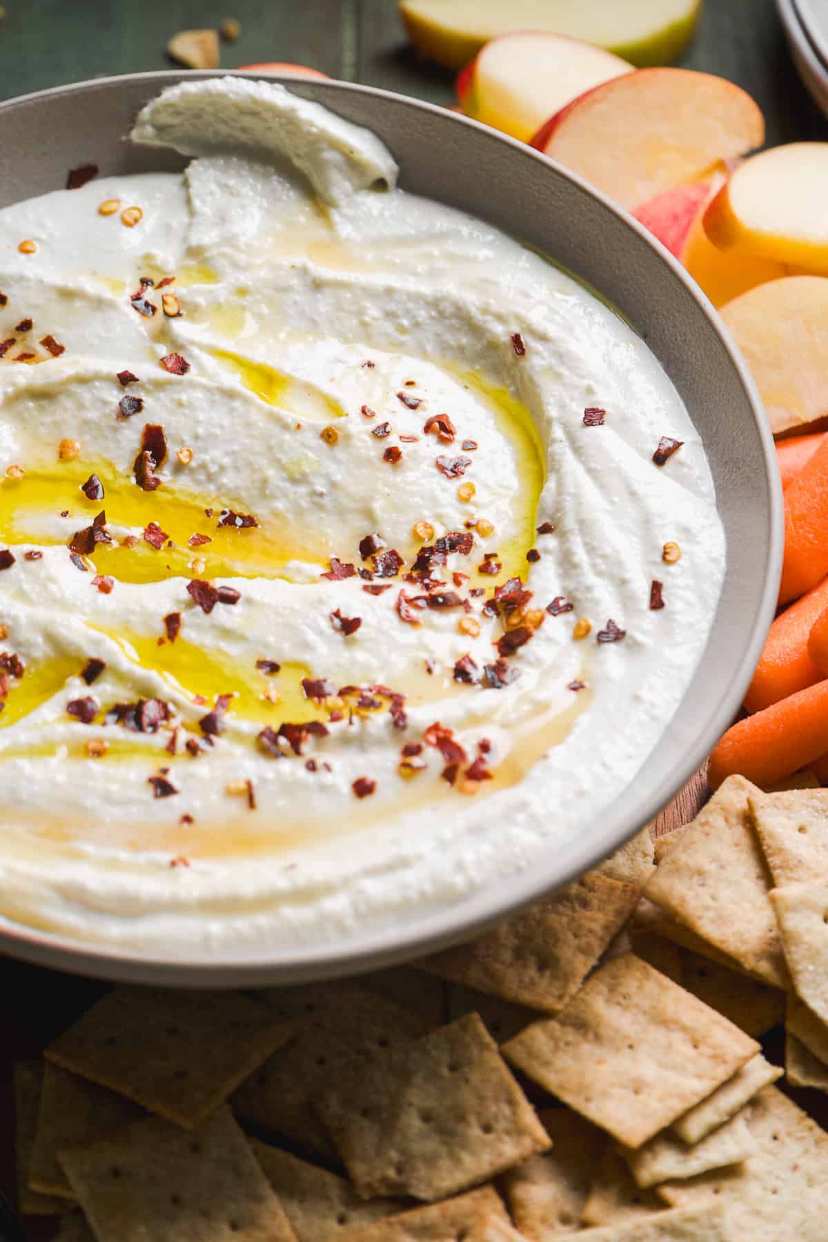 Whipped feta with red pepper flakes in a bowl.
