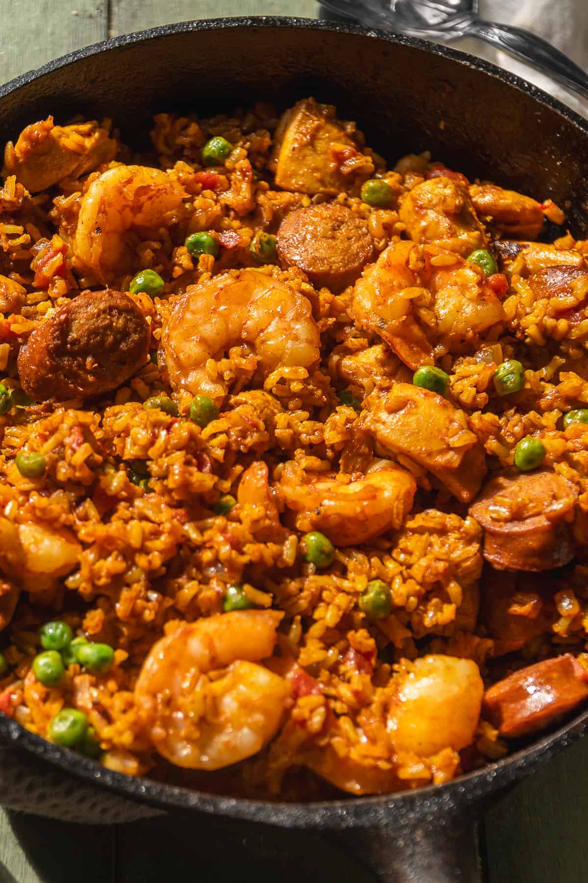 Chorizo and shrimp paella with brown rice and tomatoes.