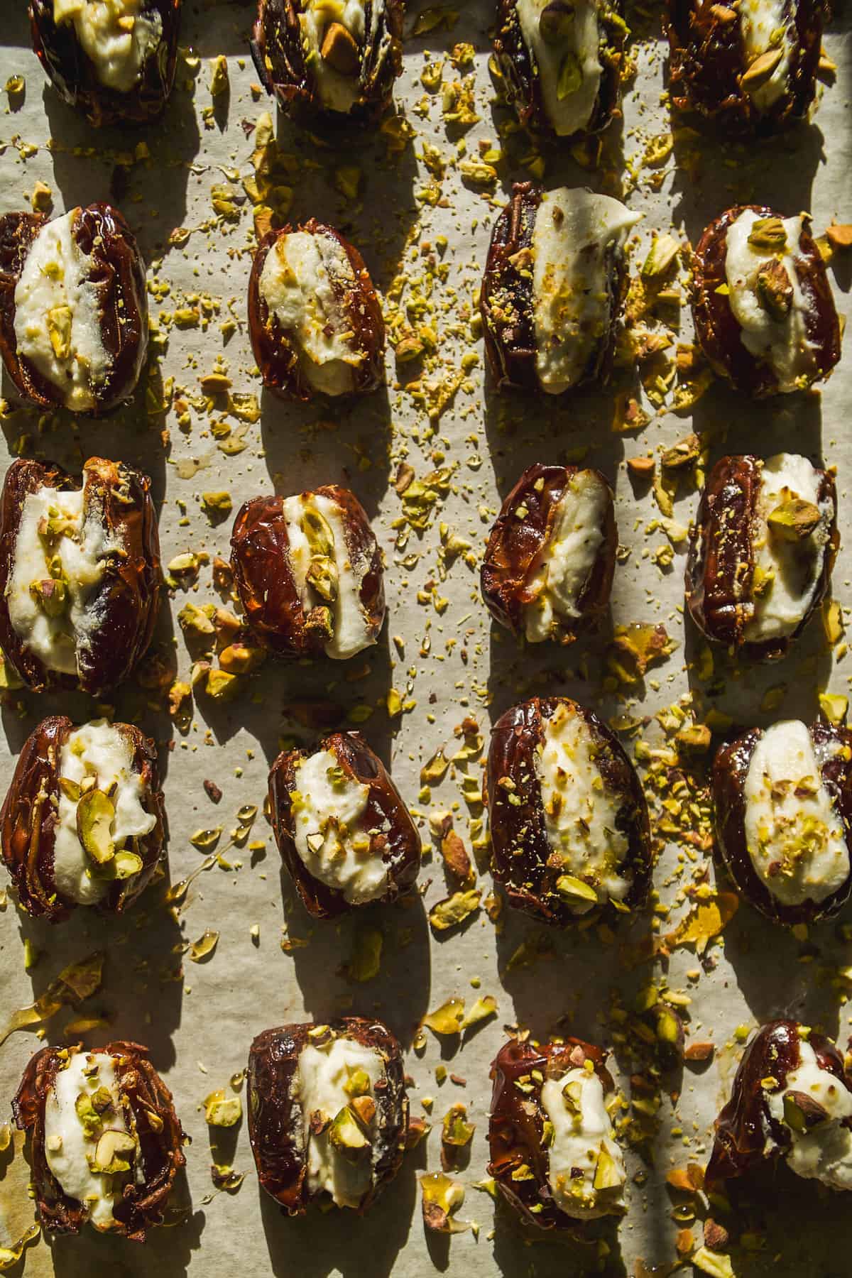 Dates stuffed with goat cheese with chopped pistachios on top.