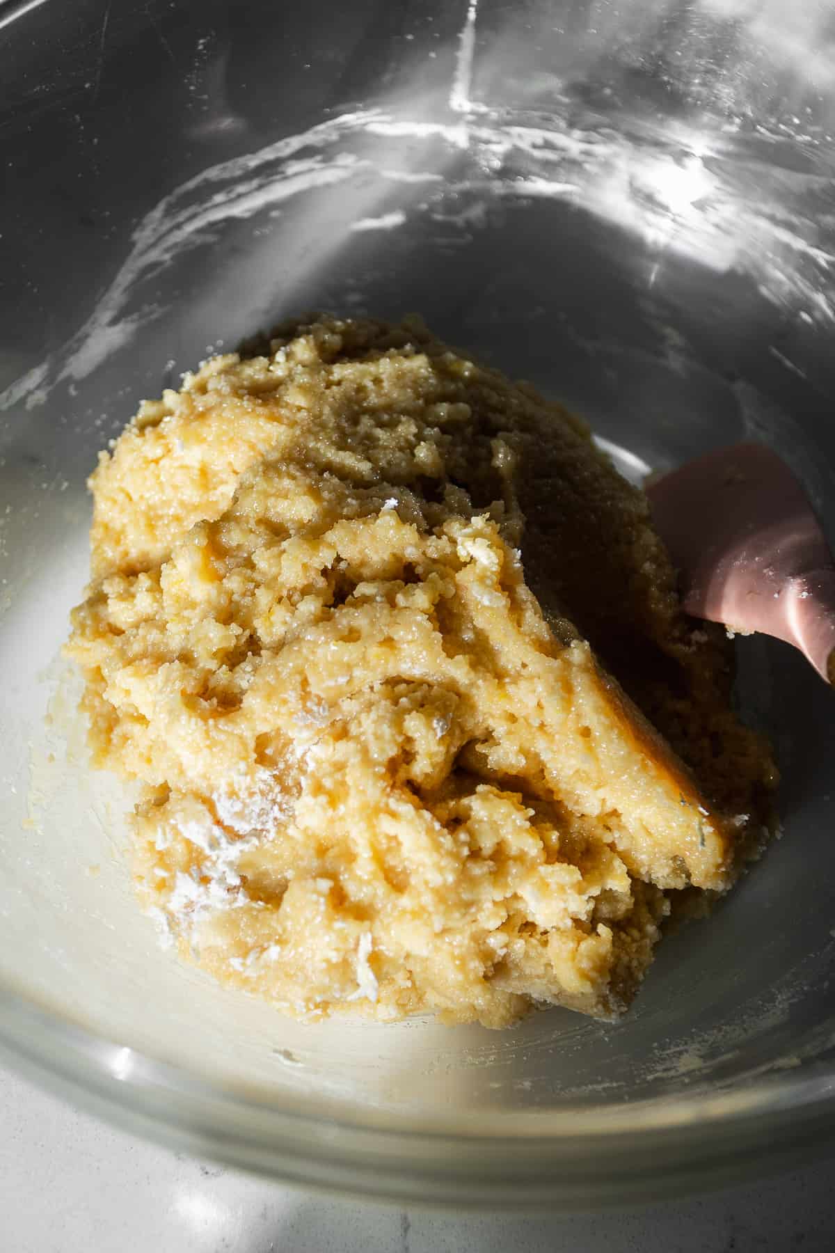 Gluten free sugar cookie dough in a bowl.