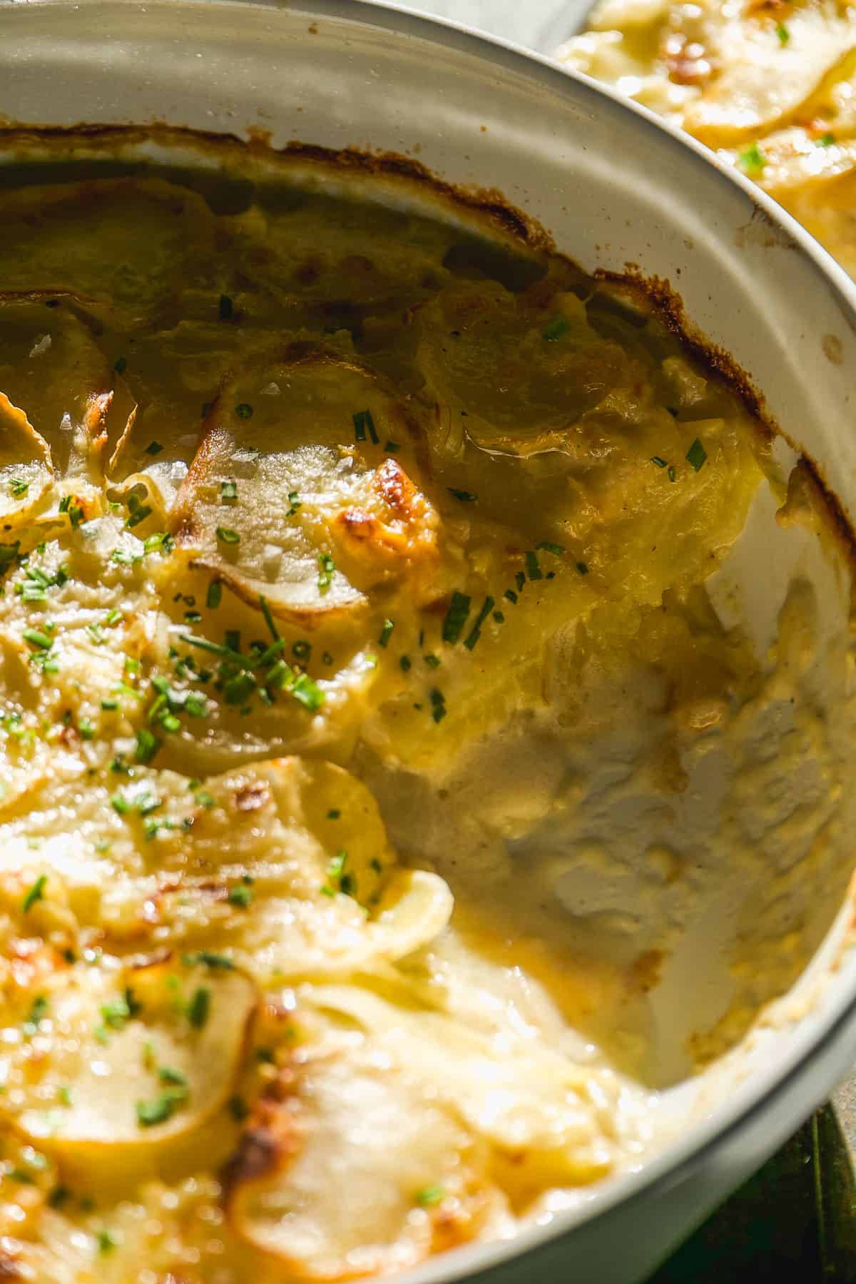 Goat cheese scalloped potatoes in a dish.