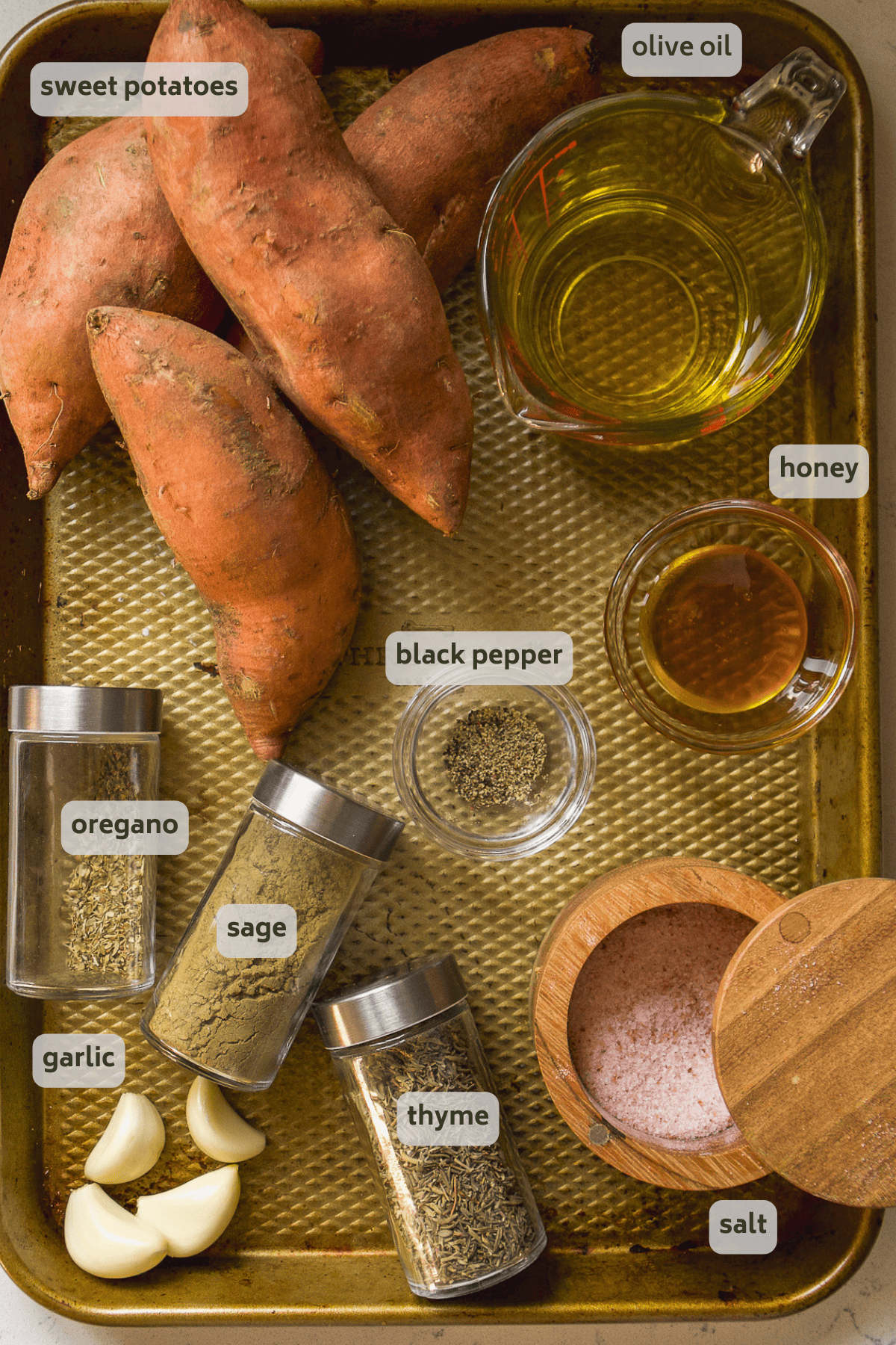 Scalloped sweet potato ingredients on a golden platter.