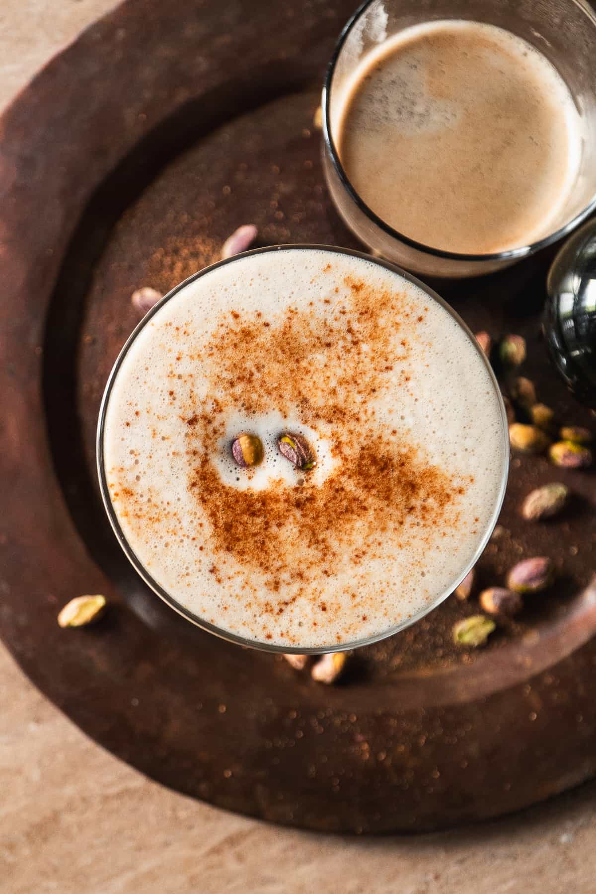 Overhead view of a baklava espresso martini on a platter.