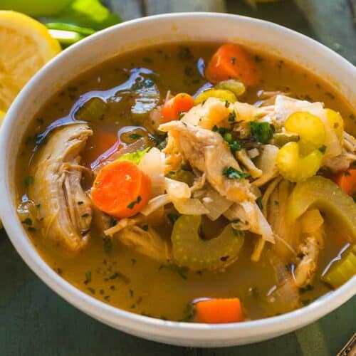 Lemon chicken soup with veggies in a bowl.