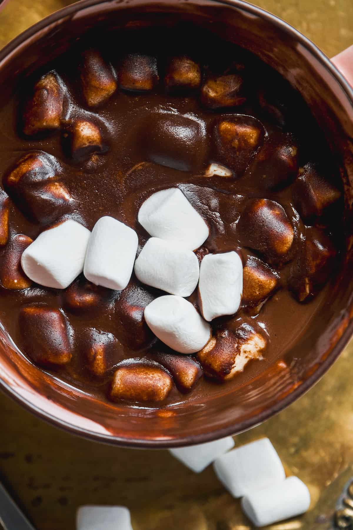Hot chocolate with dairy free milk in a mug with marshmallows on top.