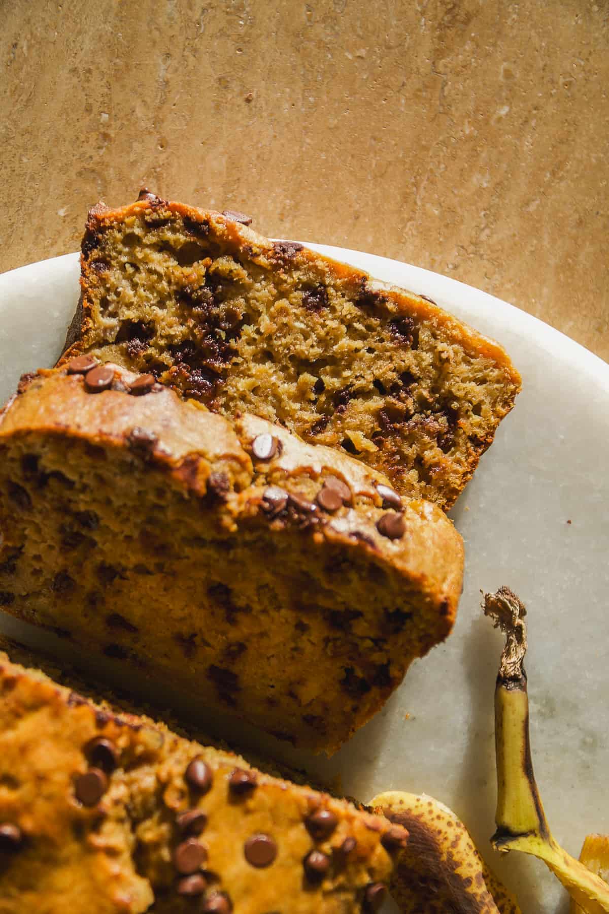 Banana bread made with oat flour cut into slices.