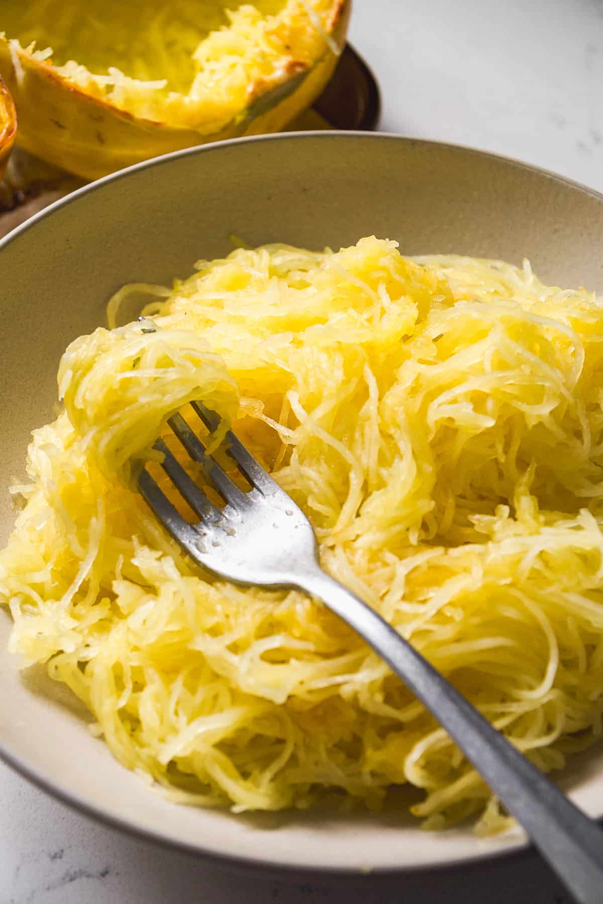 Spaghetti squash in a big bowl with a fork.