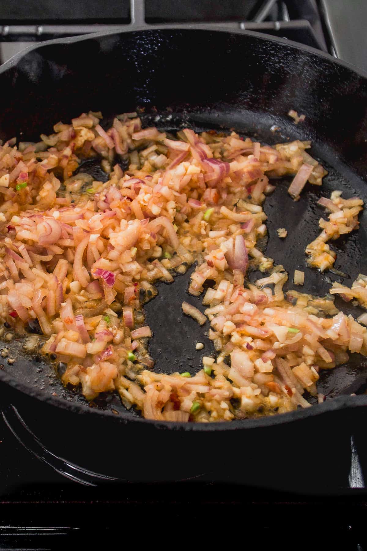 Shallots and onions sauteed in cast iron skillet.