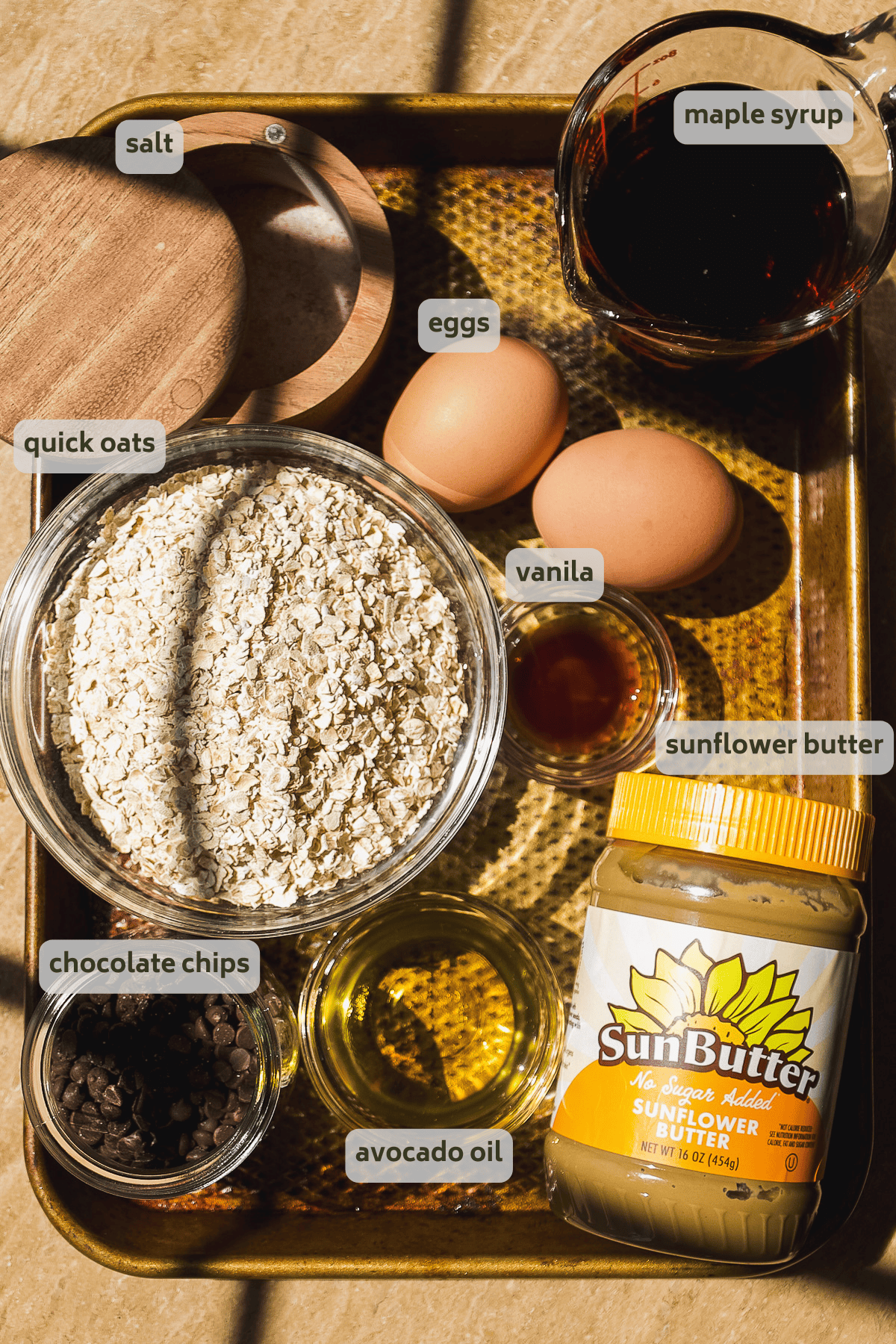 Oatmeal bar ingredients on a pan with labels.