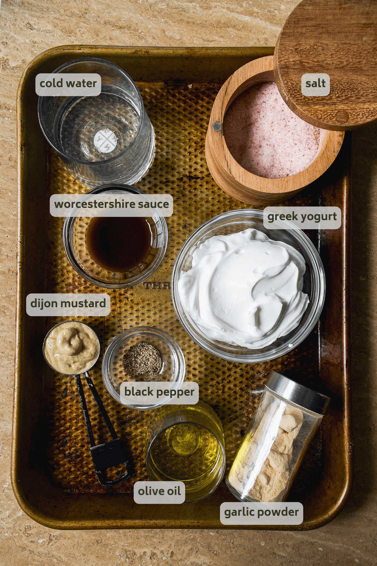 Greek yogurt salad dressing ingredients on a pan.