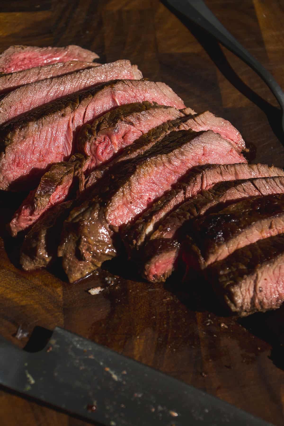 Up close view of steak cut into strips.