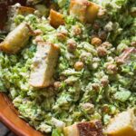 Brussel sprout caesar salad with chickpeas and sourdough croutons.