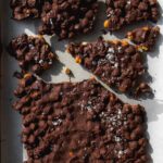 Chocolate covered chickpea bark on parchment paper.