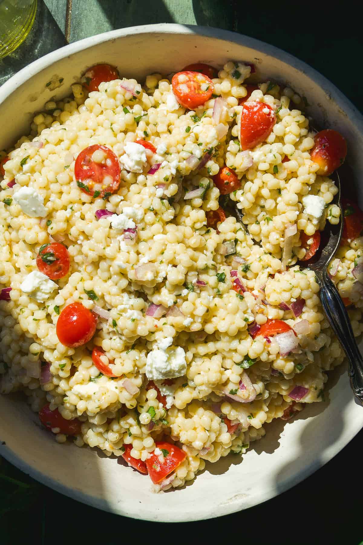 Couscous salad with feta, tomatoes, and herbs.