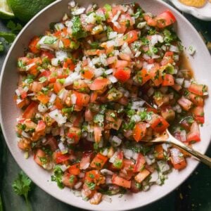 Overhead view of pico de gallo in a bowl with a chips.