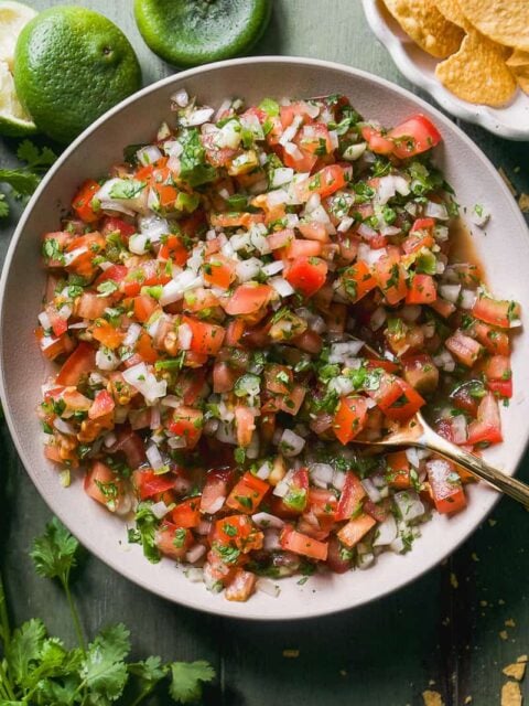 Pico de gallo in a white bowl.