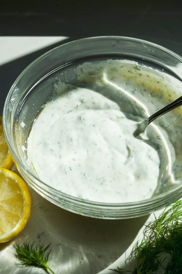 Creamy dil yogurt sauce in a bowl.